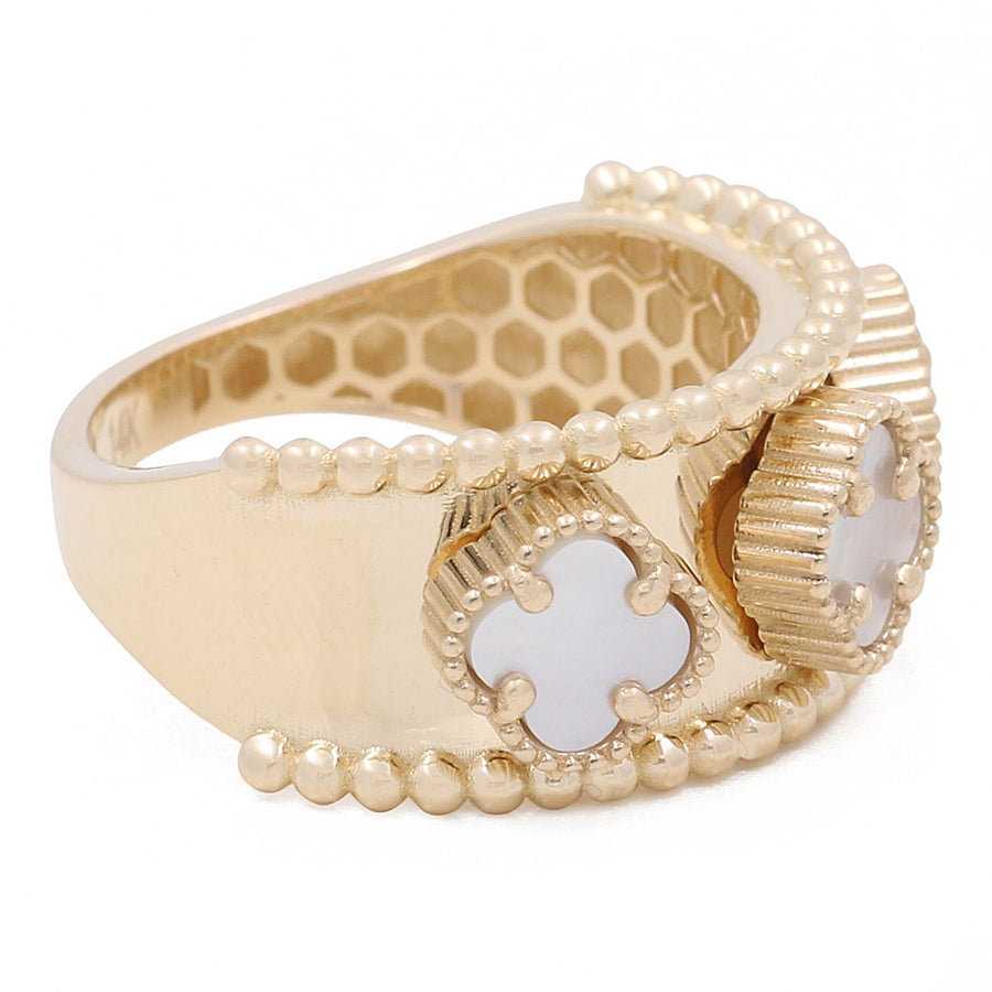 Miral Jewelry's 14K Yellow Gold Mother of Pearl Flowers Ring features a decorative band with a bee motif using white enamel and small Mother of Pearl embellishments on a plain background.
