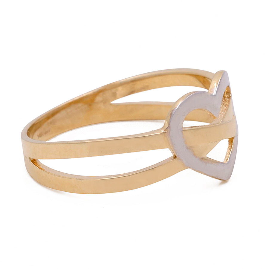 Miral Jewelry's 14K Yellow and White Gold Heart Ring, featuring an intertwined heart design, is isolated on a white background.