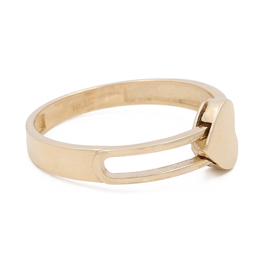 A Miral Jewelry 14K yellow gold ring with a heart-shaped top, viewed on a white background.