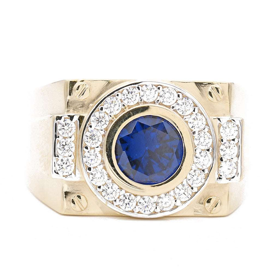 A men's Miral Jewelry yellow gold 14k fashion ring with a blue sapphire and diamonds.