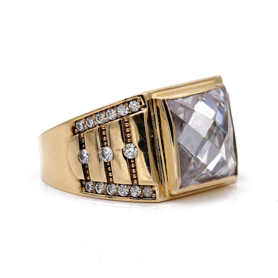 A Yellow Gold 14k Fashion Ring with Cz by Miral Jewelry adorned with a white topaz and diamonds.