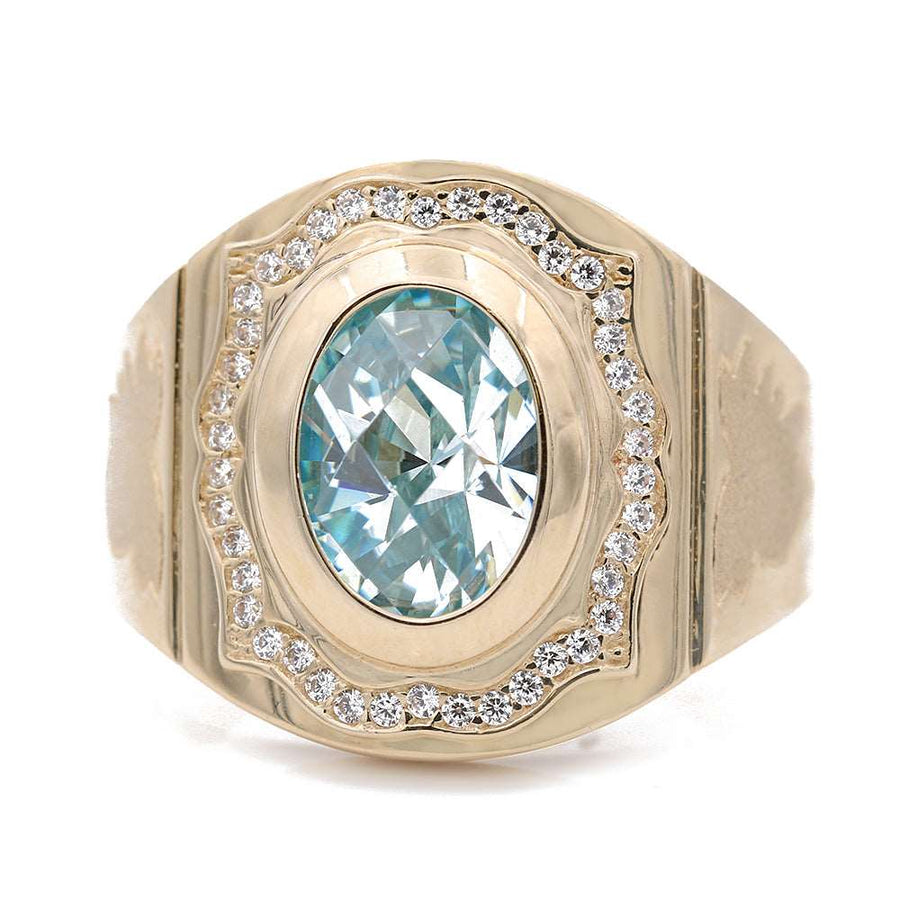 A Miral Jewelry yellow gold 14k fashion ring with a light blue topaz and diamonds.
