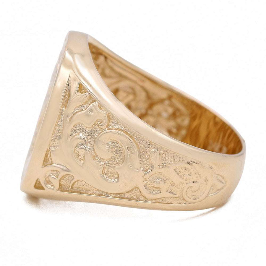 This Miral Jewelry Mason Ring showcases a luxurious style with its ornate design, crafted in 14k Yellow Gold.