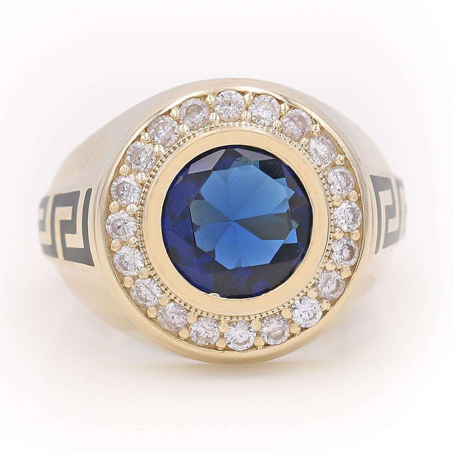 A Miral Jewelry yellow gold 14k fashion ring adorned with a blue sapphire and diamonds.