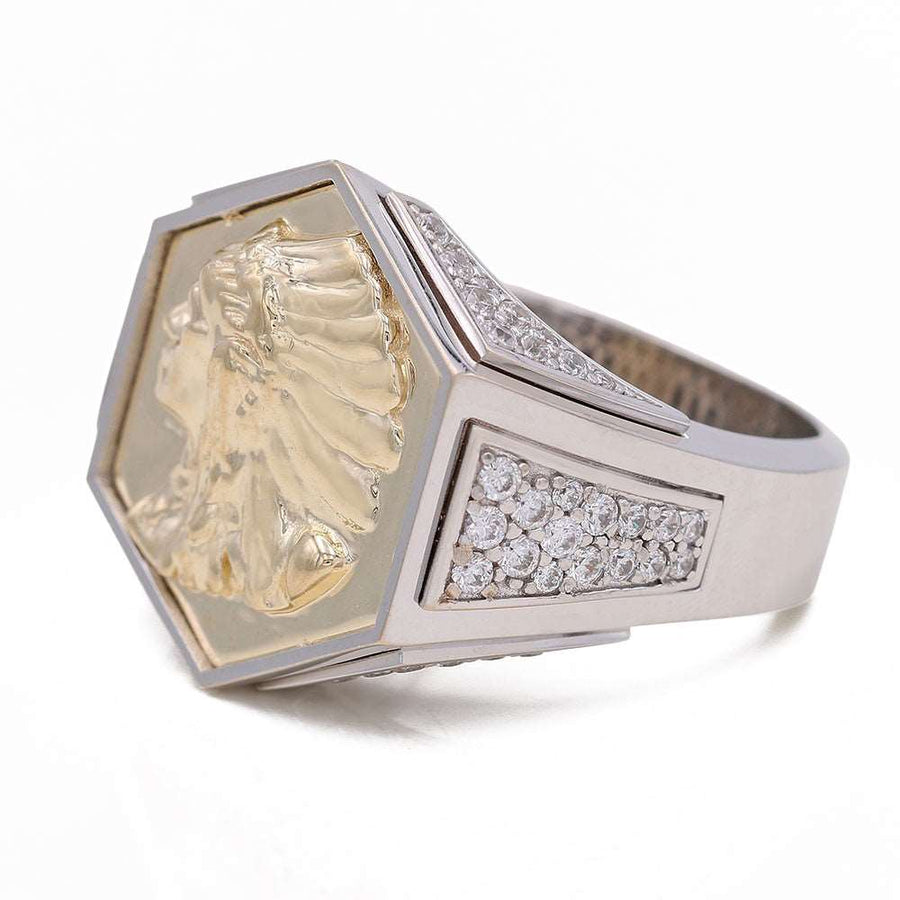A Miral Jewelry men's fashion ring adorned with an Indian head, diamonds, and crafted in 14k white and yellow gold.