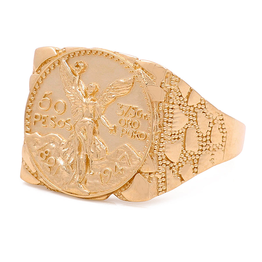 A Miral Jewelry 14K Yellow Gold Liberty 50 Pesos ring featuring an image of an angel and a coin, making a fashionable statement.