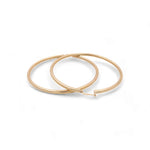 Two 14K Yellow Gold Large Hoop Women's Earrings by Miral Jewelry on a plain white background.