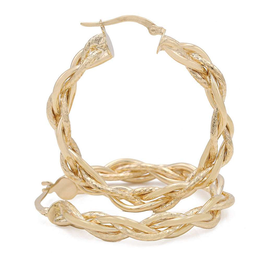 These Miral Jewelry 14k Yellow Gold Twisted Hoop Earrings make a bold statement.