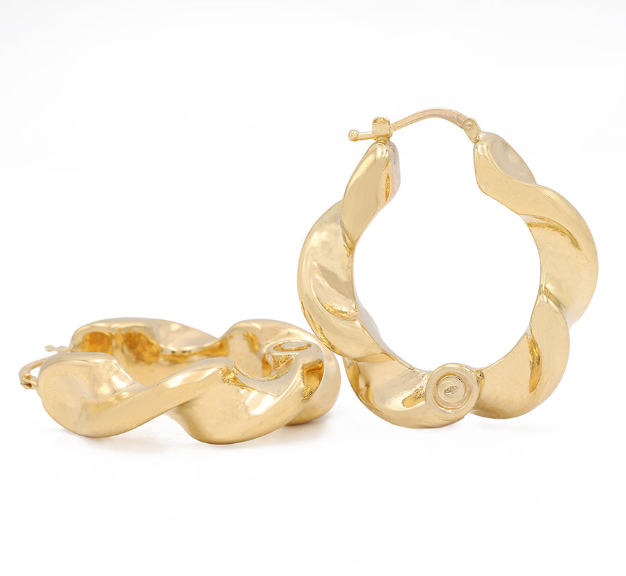 A pair of timeless classic Miral Jewelry 14k Yellow Gold Twisted Hoop Earrings.