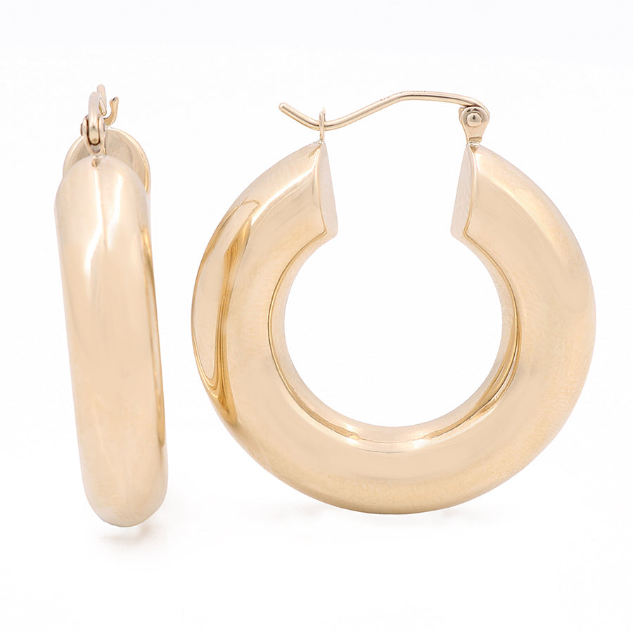 A pair of elegant Miral Jewelry 10K Yellow Gold Hoop Earrings on a white background.