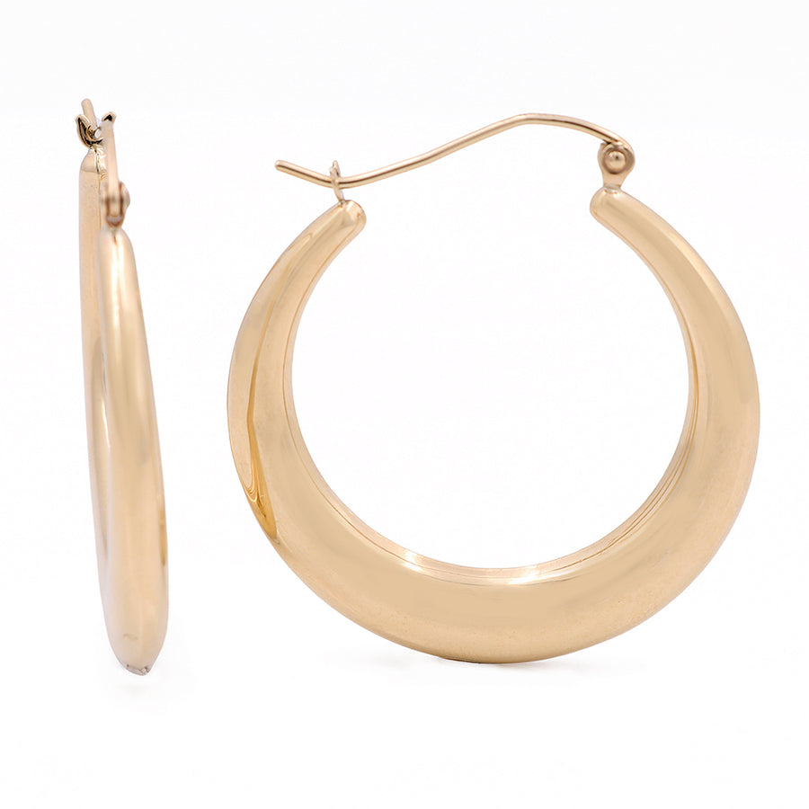 A pair of Miral Jewelry 10K yellow gold hoop earrings with a classic design on a white background.