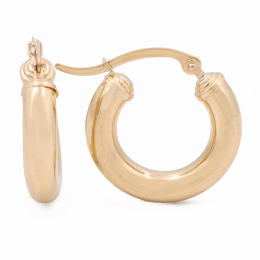 A pair of Miral Jewelry classic 10K yellow gold hoop earrings.