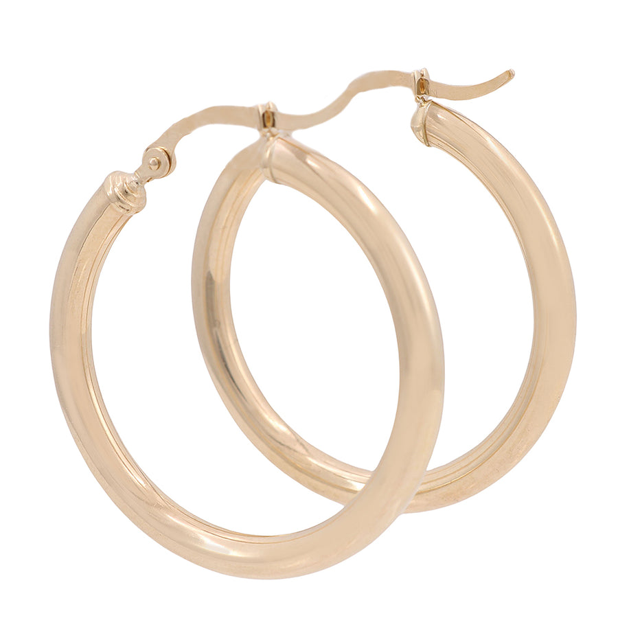 A pair of Miral Jewelry 10K Yellow Gold Hoop Earrings on a white background.