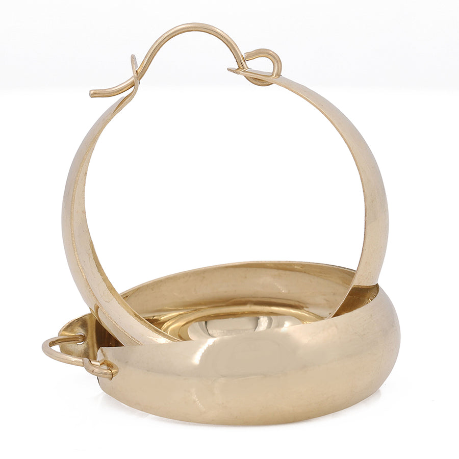 Miral Jewelry's Timeless 10K Yellow Gold Hoop Earrings on a White Background.