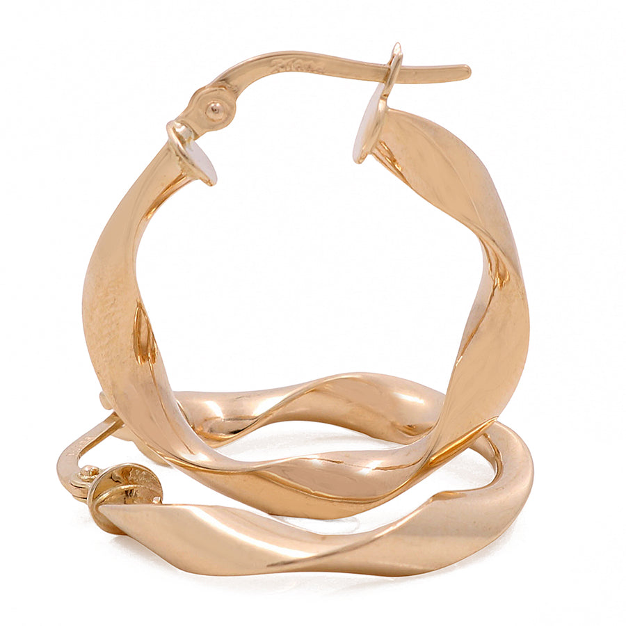 A pair of Miral Jewelry 14K Yellow Gold Fashion Hoop Earrings, a glamorous piece on a white background.
