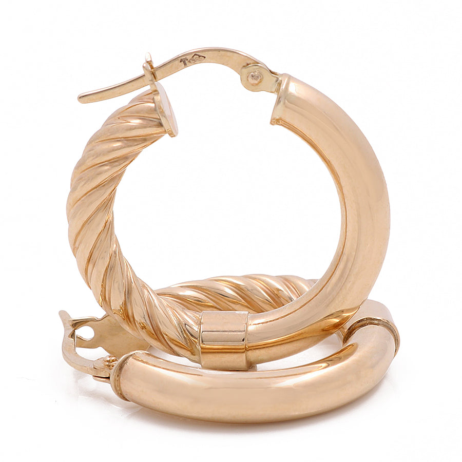 A pair of glamorous Miral Jewelry 14K Yellow Gold Fashion Hoop Earrings.