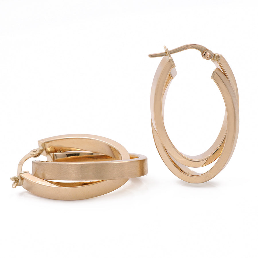 A pair of Miral Jewelry's 14K Yellow Gold Fashion Hoop Earrings on a white background.