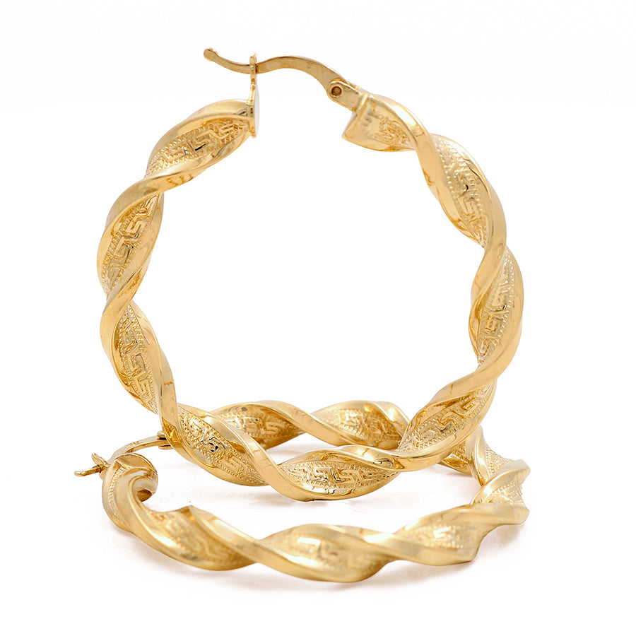 These 10K Yellow Fashion Twisted Hoops Earrings by Miral Jewelry are versatile and stylish.