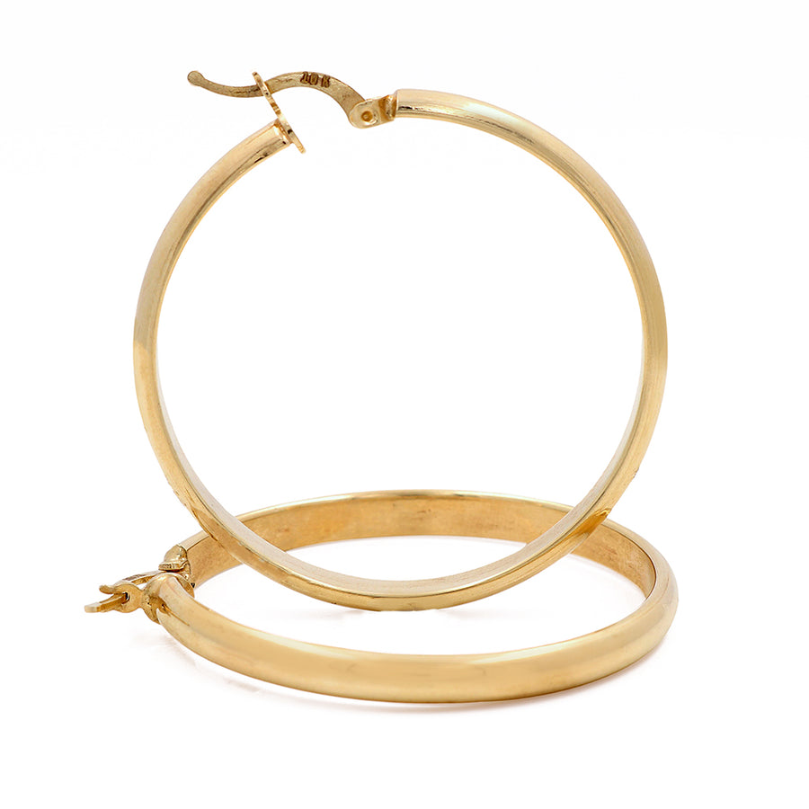 A pair of Miral Jewelry's 10K Yellow Fashion Hoops Earrings for the fashionista on a white background.
