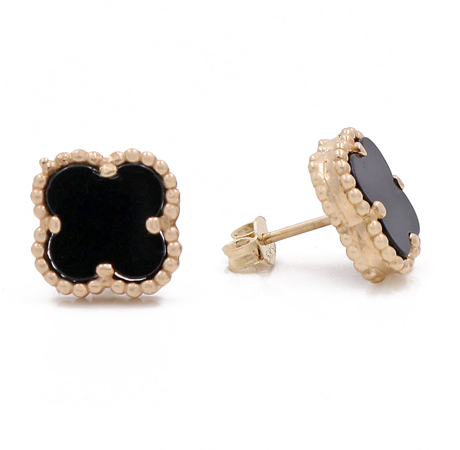 A stylish pair of Miral Jewelry 14K Yellow Gold Fashion Flower Women's Onyx Earrings, perfect for fashion-forward women.