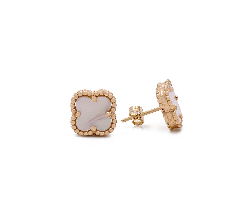 These elegant stud earrings are plated in Miral Jewelry's 14K yellow gold and feature stunning white mother of pearl accents.