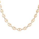 Description: The 14K Yellow Gold Marine Chain by Miral Jewelry is a timeless piece, featuring a gold chain necklace with oval-shaped links and small interlocking rings.