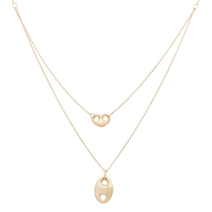 A Miral Jewelry 14k yellow gold - plated necklace with a heart shaped pendant and a fancy link chain, with a length of 17".