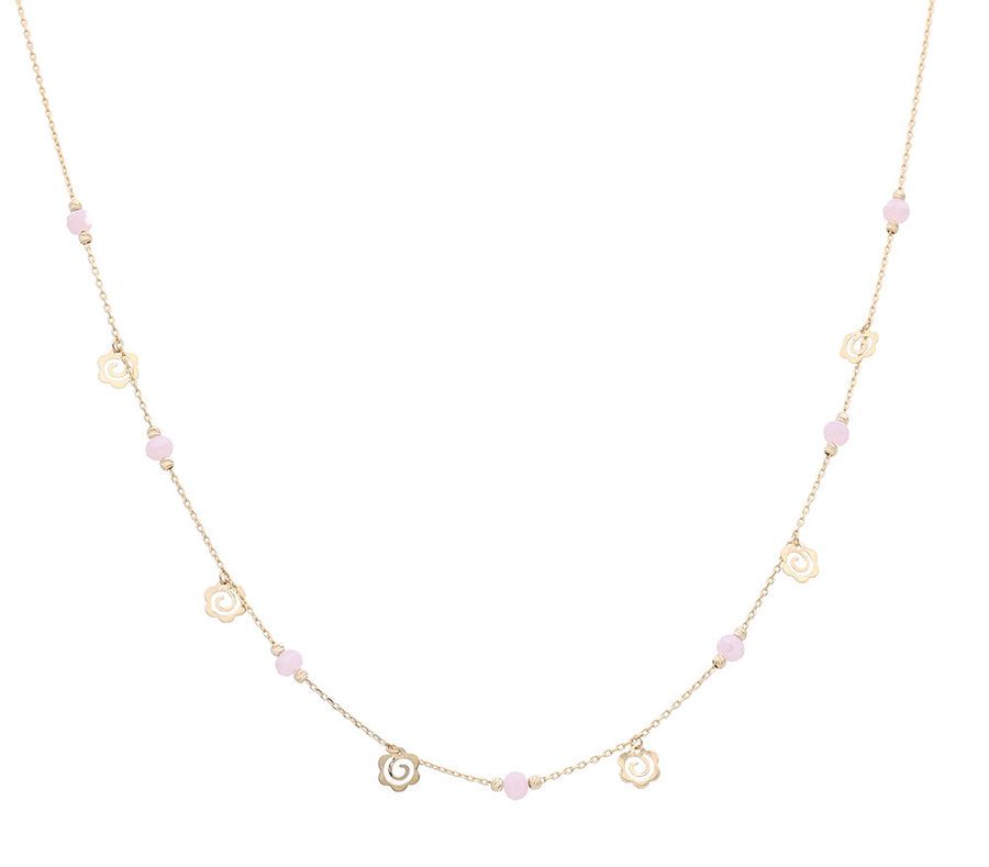A Miral Jewelry yellow gold necklace 14K adorned with pink pearls and a heart shaped charm, all delicately plated in yellow gold.