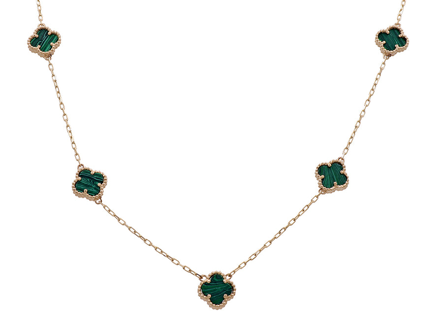 A Miral Jewelry 14K yellow gold necklace adorned with an emerald leaf charm perfect for fashion-forward individuals.