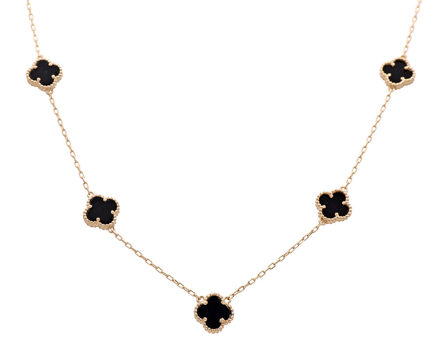 This Miral Jewelry necklace features black onyx stones and a 14K yellow gold chain.