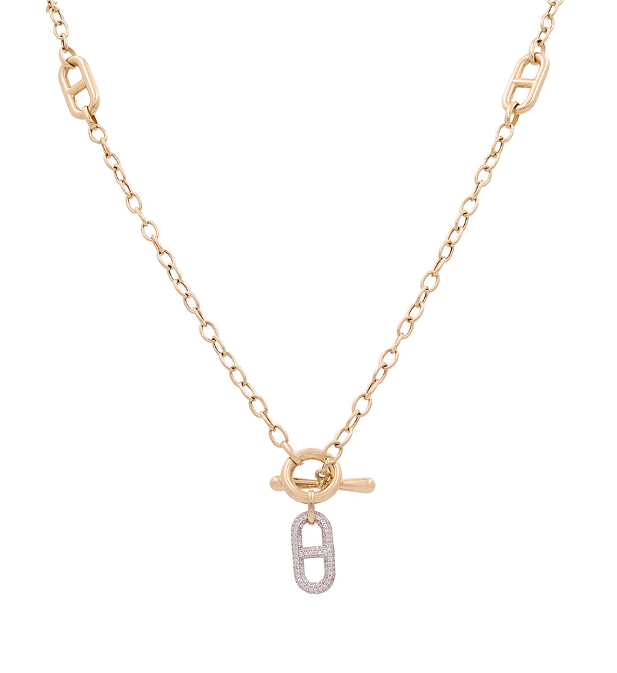 A Miral Jewelry necklace with a lock and a diamond on it, accented with 14K Yellow Gold.