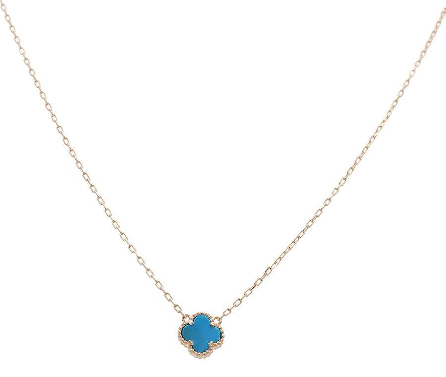 A necklace with a turquoise stone on a gold chain made of Miral Jewelry's 14K Yellow Gold Fashion Flower Women's Blue Stone Necklace.