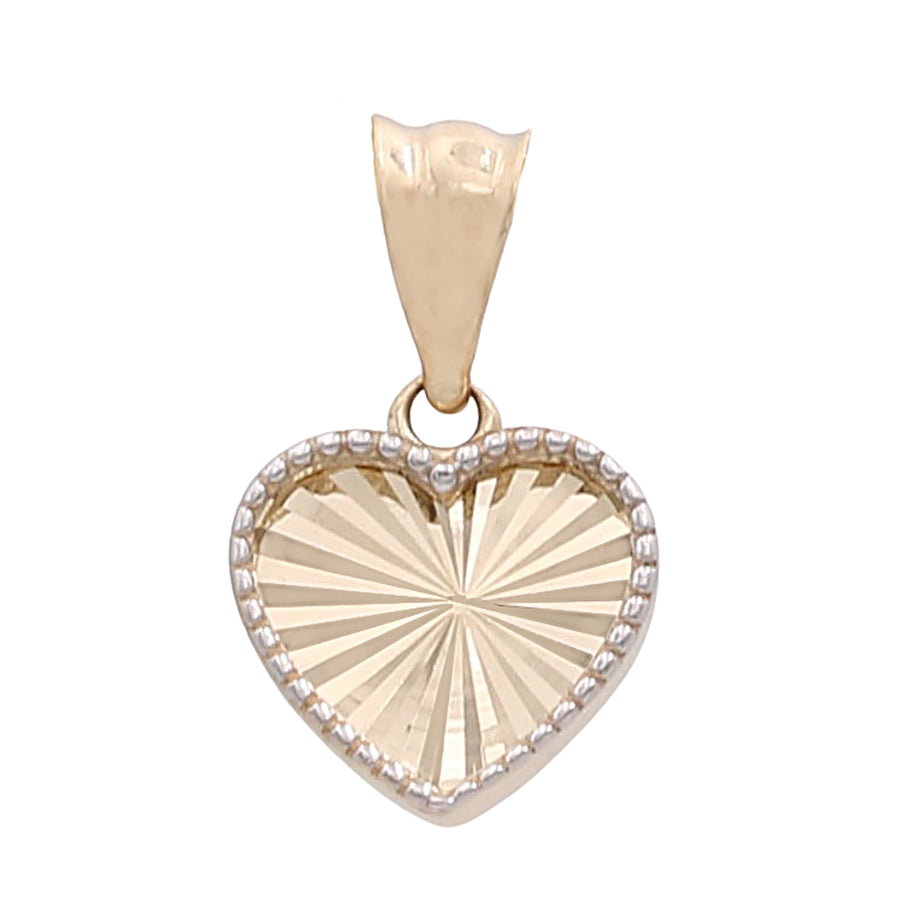 A Miral Jewelry 14K Yellow Gold Heart with Diamond Cut Pendant adorned with diamonds.