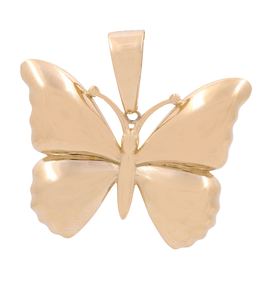 A Miral Jewelry 14K yellow gold butterfly pendant on a white background exudes elegance.