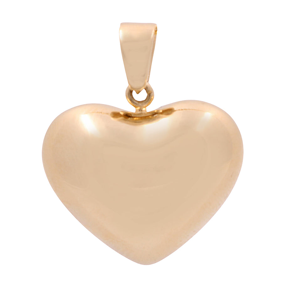 A statement piece, the Miral Jewelry 14K yellow gold fashion heart pendant shines on a white background.