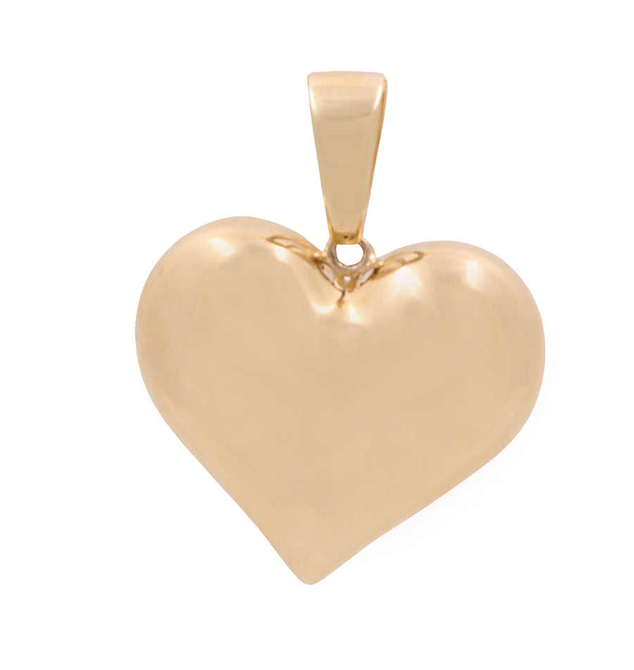 An elegant Miral Jewelry 14K Yellow Gold Fashion Heart Pendant shines on a white background, exuding fashion and sophistication.