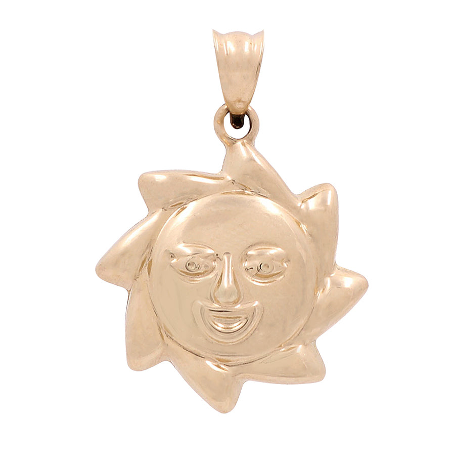 A Miral Jewelry 14K Yellow Gold Fashion Sun pendant with a face on it, perfect for adding a touch of elegance to your outfit.