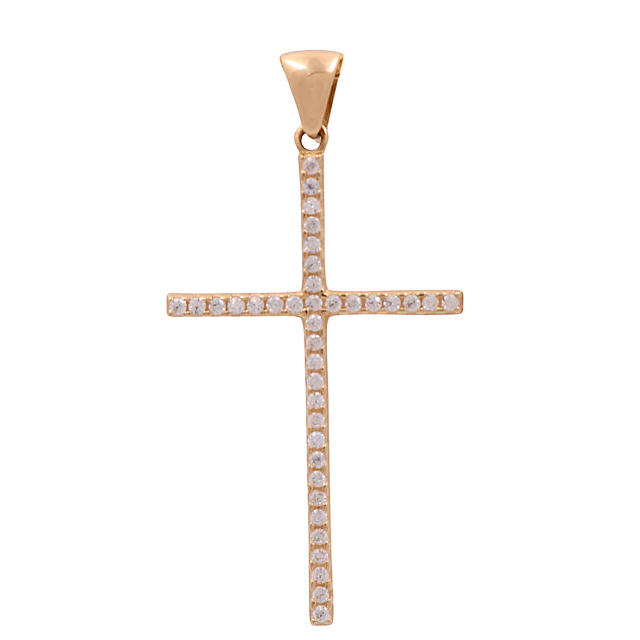 A 14K yellow gold cross pendant with sparkling cubic zirconias from Miral Jewelry.