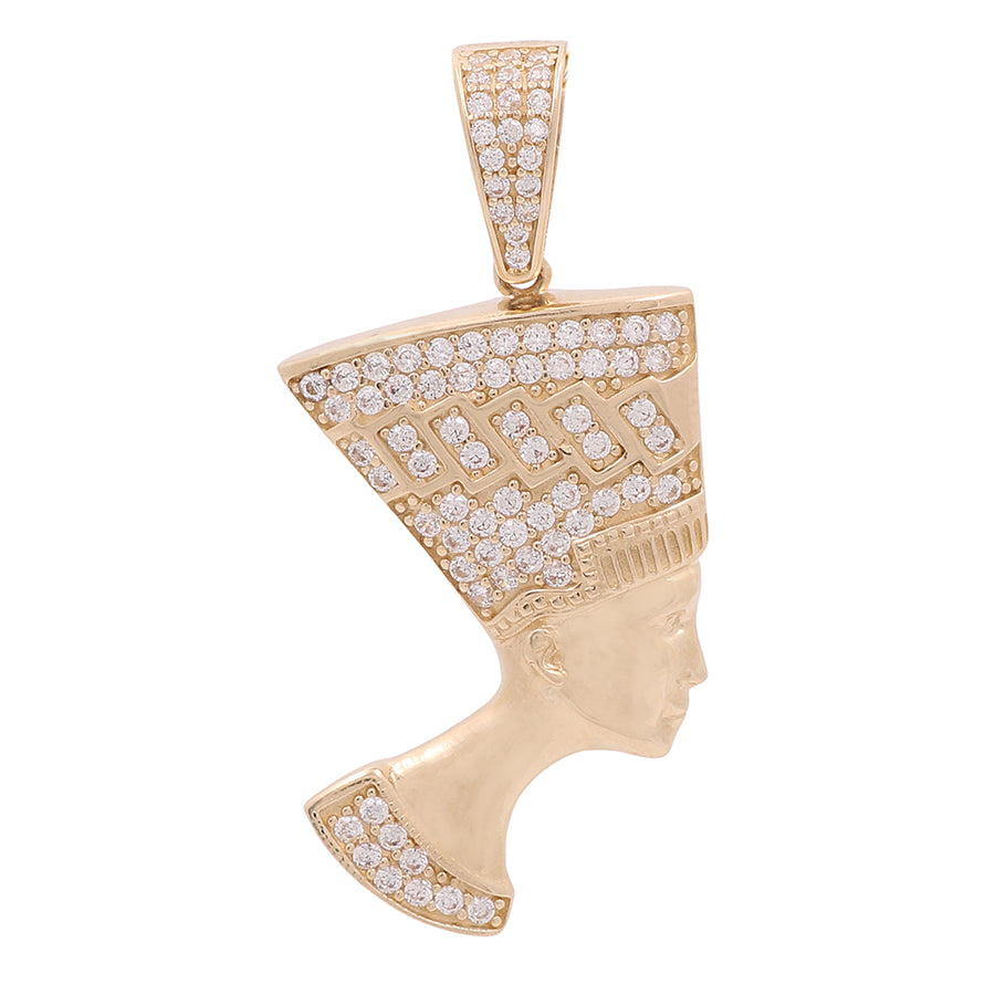 An Egyptian head pendant with cubic zirconias set in a Miral Jewelry 14K Yellow Gold.