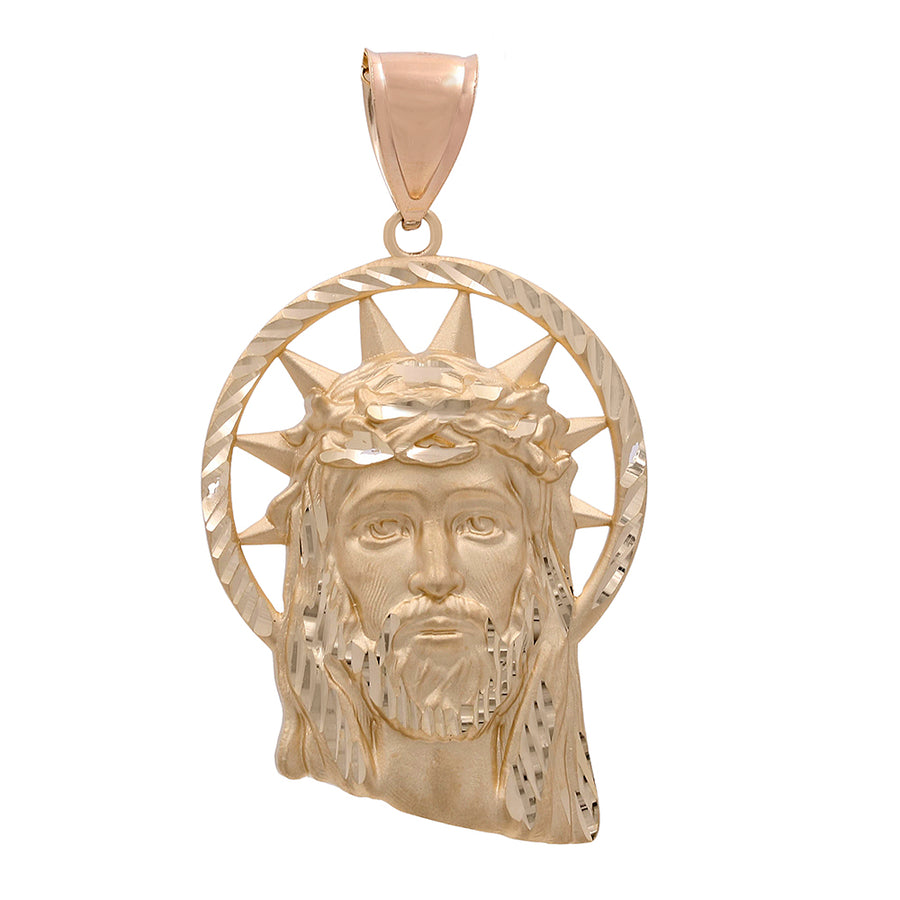 Miral Jewelry's 14K Yellow Gold Jesus Head Pendant featuring a detailed depiction of Jesus Christ on the cross, set within a radiant halo design, crafted in 14K yellow and white gold.