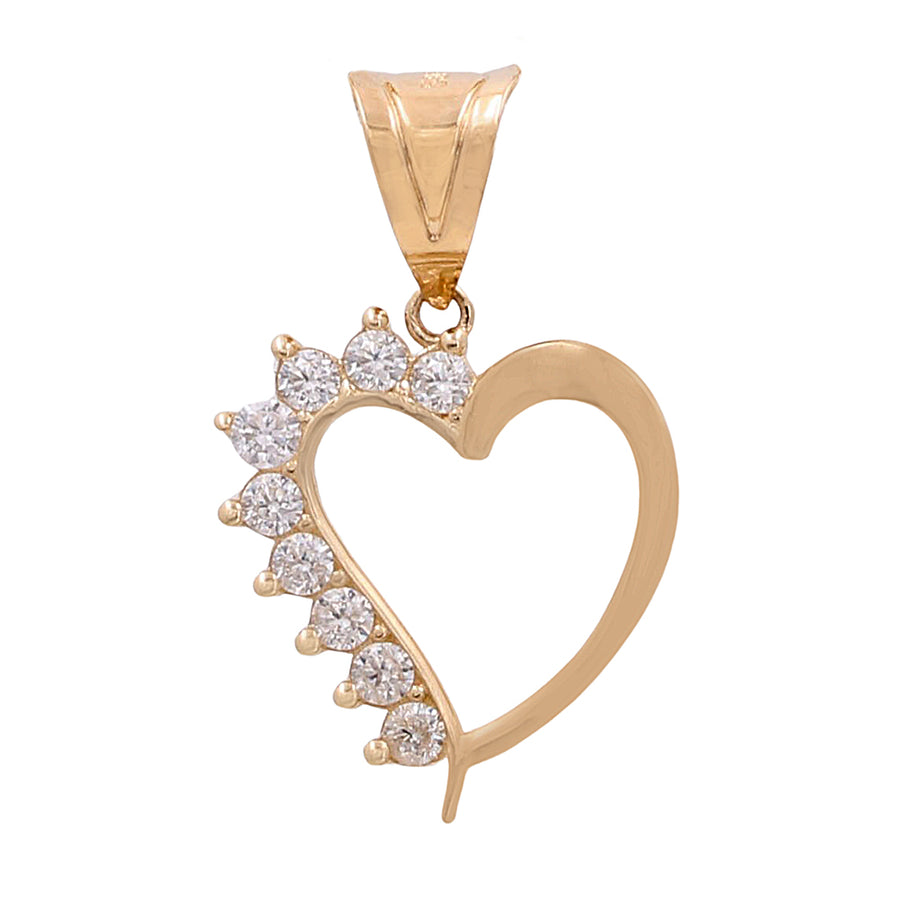 14K Yellow Gold heart-shaped pendant with cubic zirconias on one side, isolated on a white background from Miral Jewelry.