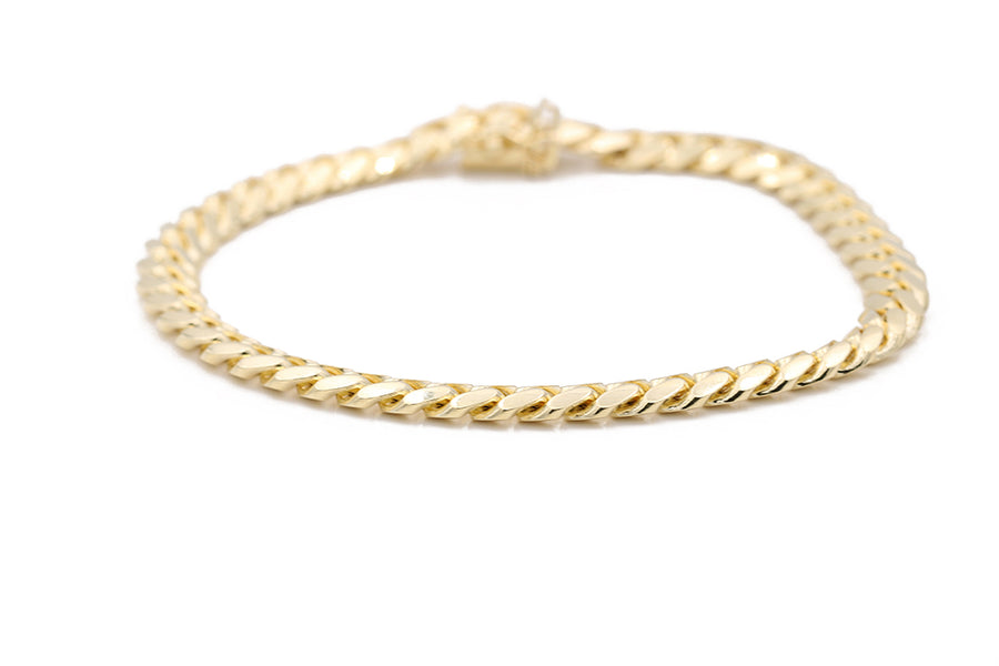 A Miral Jewelry Men's Yellow Gold 14K Cuban Link Bracelet.