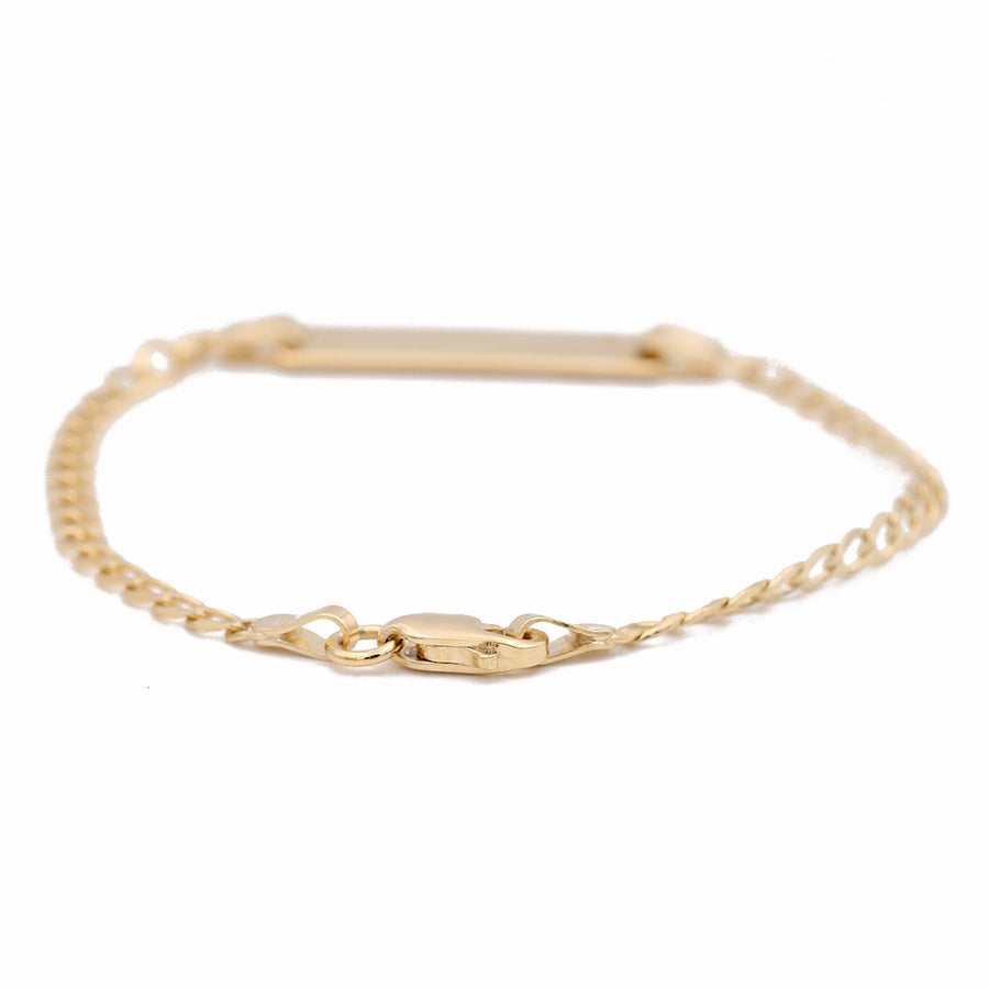 A Kid's Yellow Gold 14K ID Bracelet with an engraved bar by Miral Jewelry.