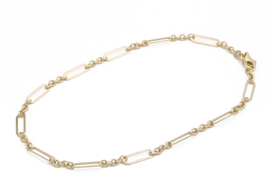 A Miral Jewelry fashion-forward Yellow Gold 14k Fashion Ankle Bracelet with a small link.