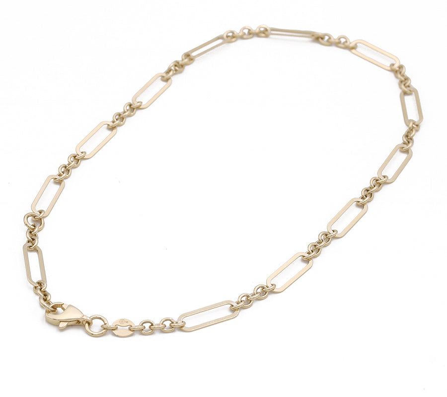 A Miral Jewelry yellow gold 14k fashion ankle bracelet with a clasp, adding an elegant touch to any fashion look.