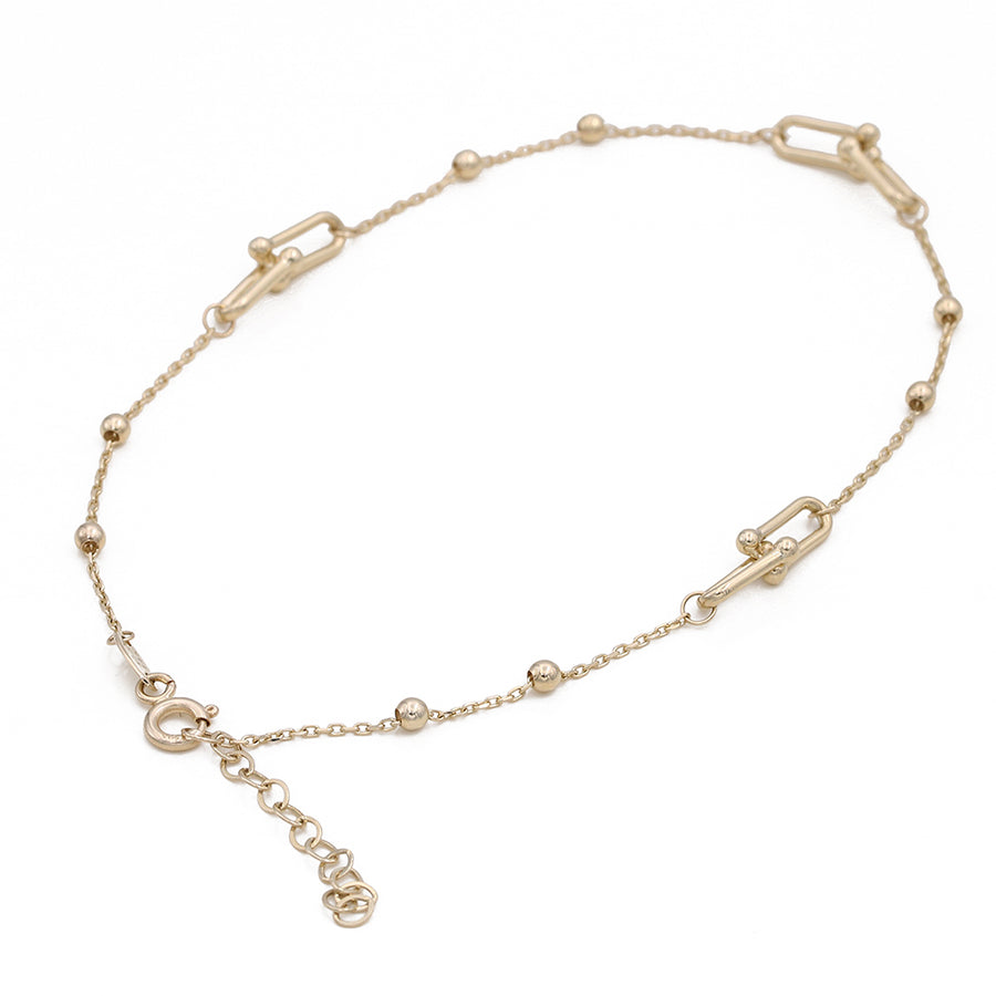 A Miral Jewelry 14K Yellow Gold Beads and Links Ankle Bracelet.