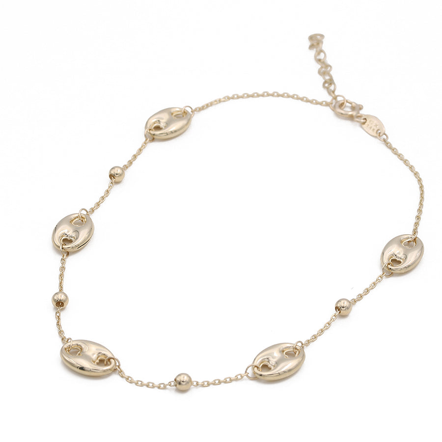 A Miral Jewelry 14K Yellow Fashion Beads Ankle Bracelet with a gold-plated lobster clasp.