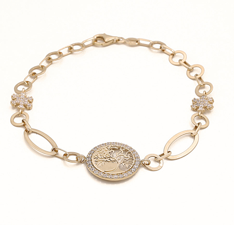 A Yellow Gold 14K Tree of Life Bracelet with a coin and diamonds from Miral Jewelry.
