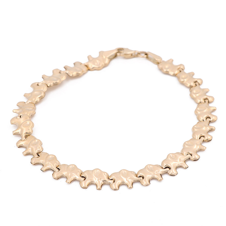A Miral Jewelry Yellow Gold 14K Elephant Bracelet with a star shaped clasp.