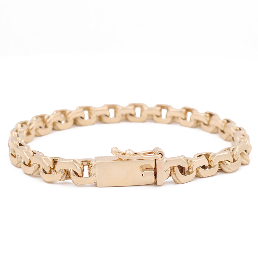 A Yellow Gold 14K Fashion Bracelet by Miral Jewelry, with a clasp, perfect for adding a touch of fashion to any outfit.